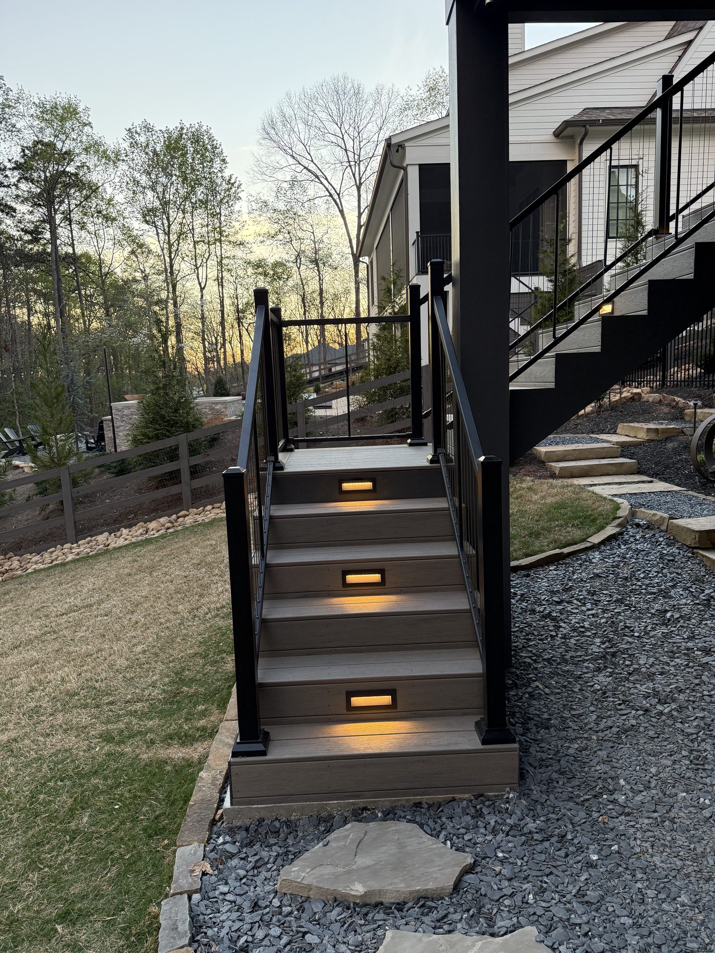 Lakeside dock with blue LED lighting at night